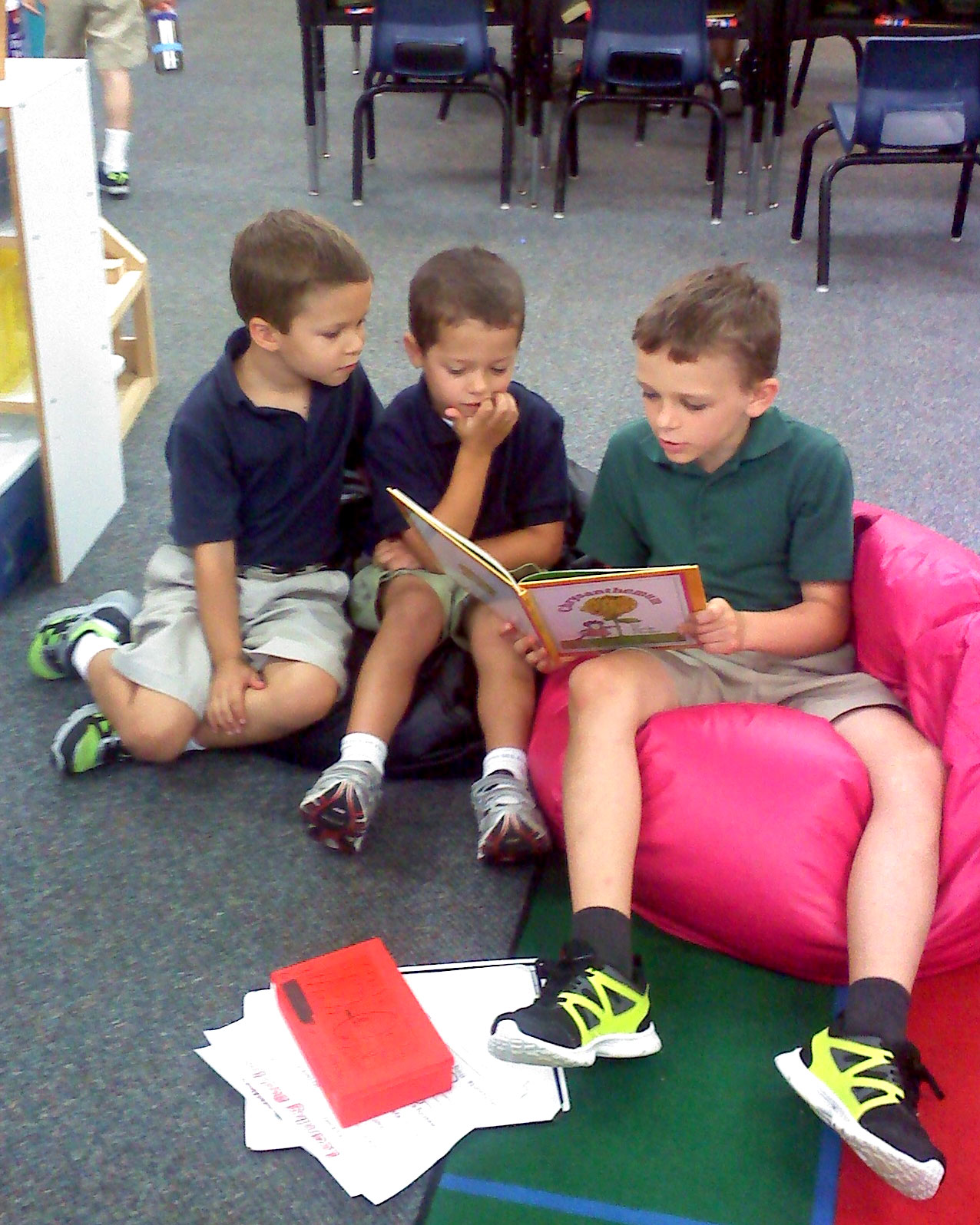 5th grader with his kindergarten reading buddies.