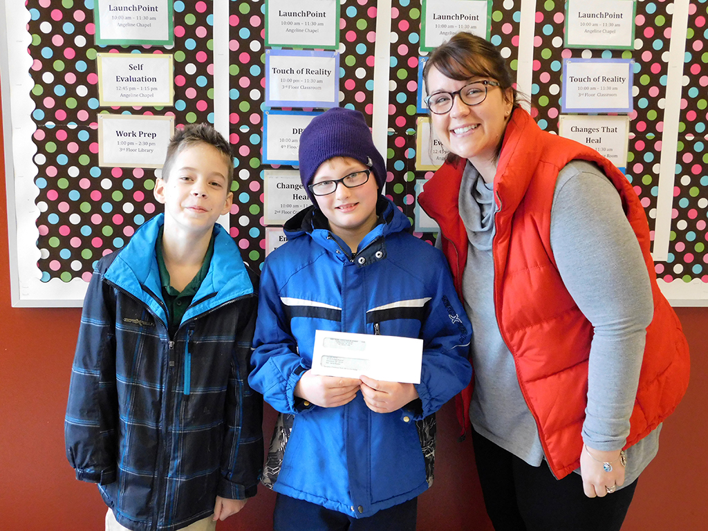 3rd & 4th Grades Present Check to Laura's Home